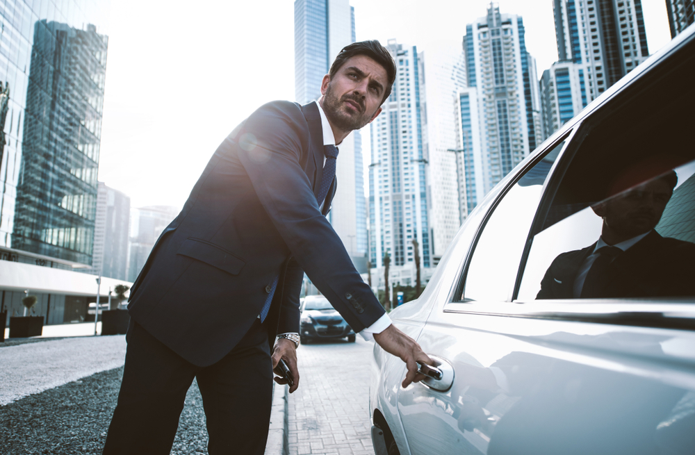 A man renting a limo for a corporate event.