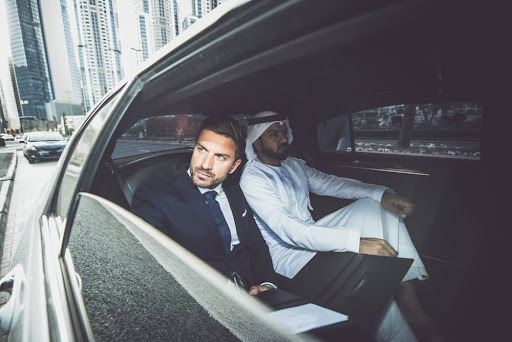 Businessmen in a rented limo for a corporate event.